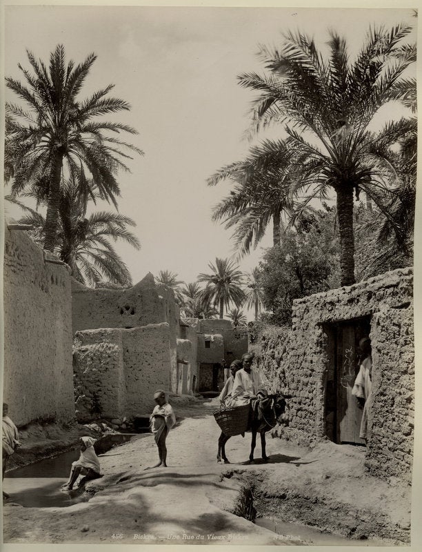 Item #14065 Photo of Arabian Ruins and Men with Donkey, Circa 1890s. Photograph Arabia.