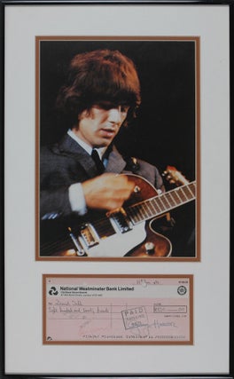Item #14105 George Harrison Signed Check Nicely Framed with his Photograph. George Harrison