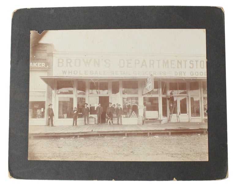 Item #18693 Original Photo Circa 1890 of the Strip of an Old West Town. Store Old West.