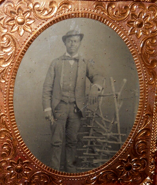 Tintype photograph of African American Man Beside Hay Drying Rack. Photography African American.